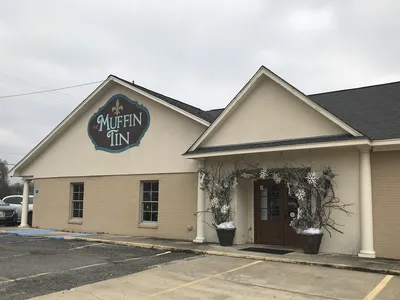 Carefully curated gift shop with diverse merchandise displays featuring unique cookware, jewelry, and specialty items in...