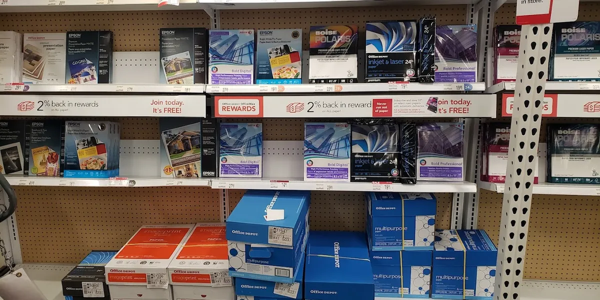 Well-stocked office supply aisles with printing services counter at Office Depot's bright, organized Louisville Avenue...