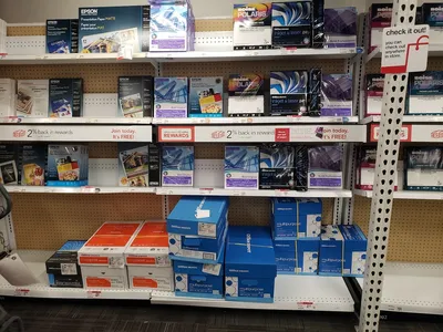 Well-stocked office supply aisles with printing services counter at Office Depot's bright, organized Louisville Avenue...