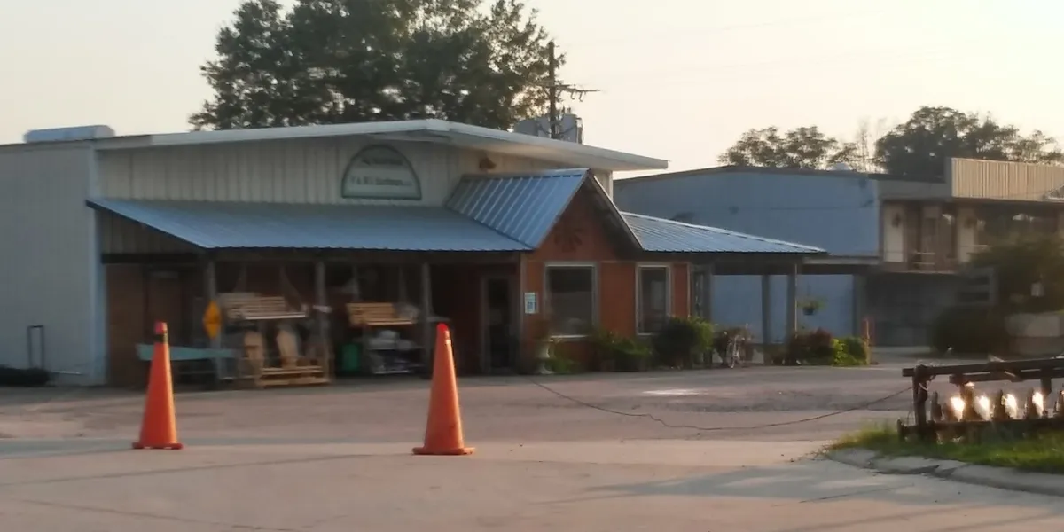 Cozy local hardware store with well-stocked shelves, garden center featuring healthy plants, and display area with white...