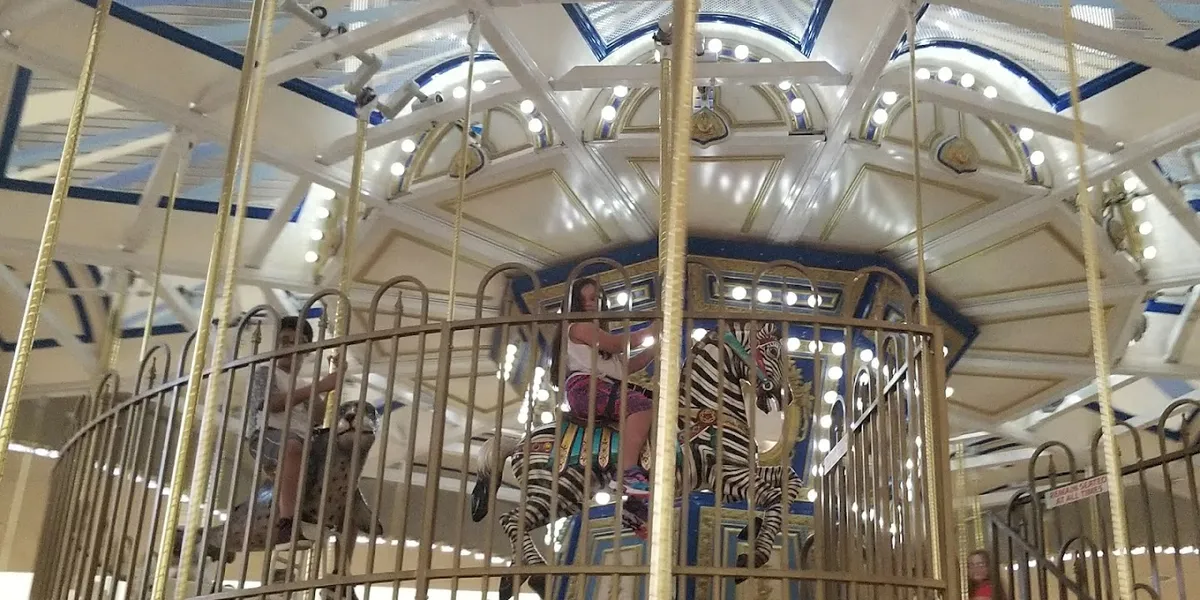 Spacious interior of Pecanland Mall with storefronts lining the walkways, featuring typical mall architecture and...