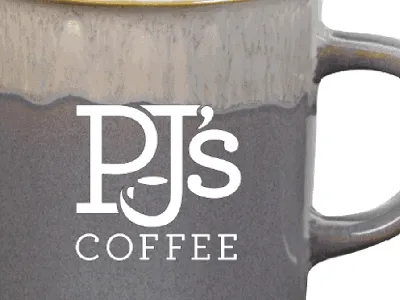 Bright coffee shop with outdoor seating area, serving specialty drinks and beignets in a clean, inclusive atmosphere on...