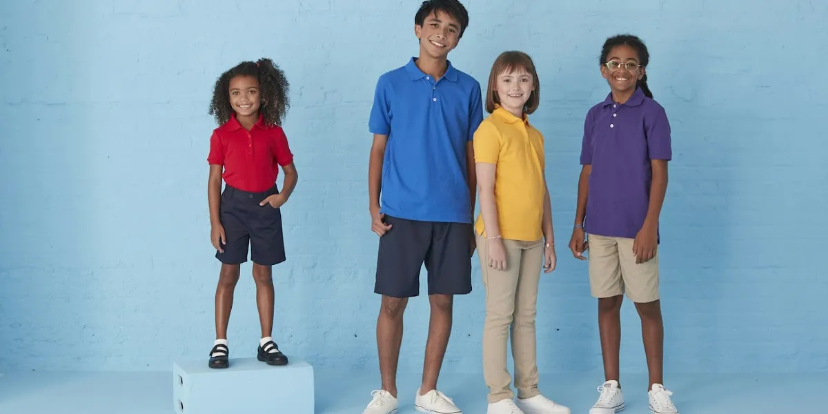 Bright, organized women's clothing store with neatly arranged racks of affordable fashion, jewelry displays, and shoe...