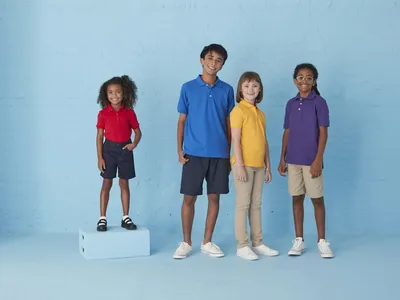 Bright, organized women's clothing store with neatly arranged racks of affordable fashion, jewelry displays, and shoe...