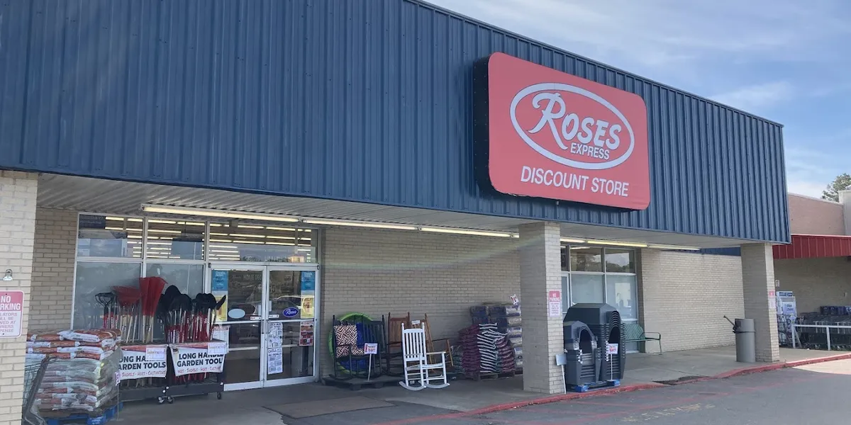 Compact discount store with narrow aisles displaying various merchandise at budget prices, creating a small-scale...