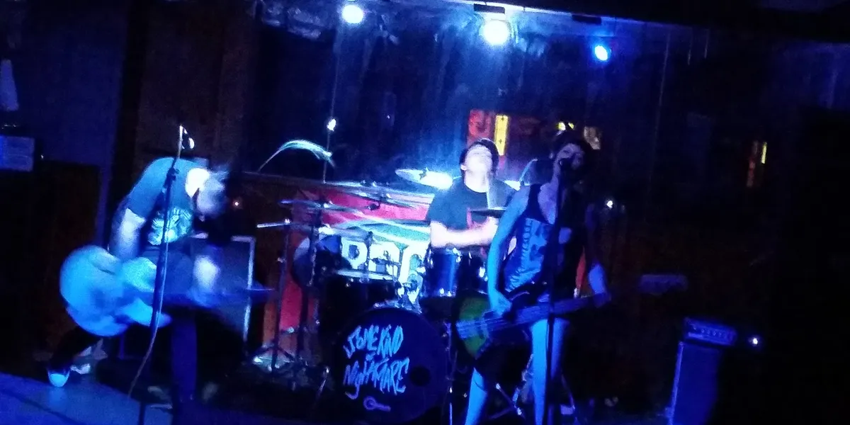 Dimly lit interior of Sal's Saloon showing pool tables, bar counter, and vintage decor creating a classic dive bar...