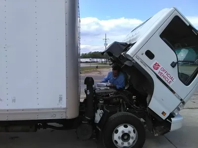 Modest thrift store with varied inventory displays, featuring affordable household items and books arranged in browsable...