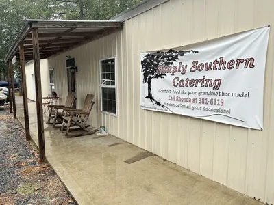 Bright, clean cafeteria-style Southern restaurant with serving line, cozy seating area, and staff dishing out home-cooked...