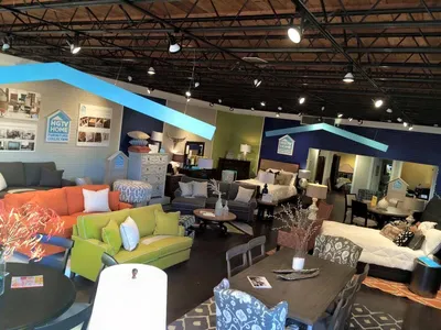 Spacious showroom with arranged furniture vignettes showcasing custom home and patio collections at Sleepy Hollow...