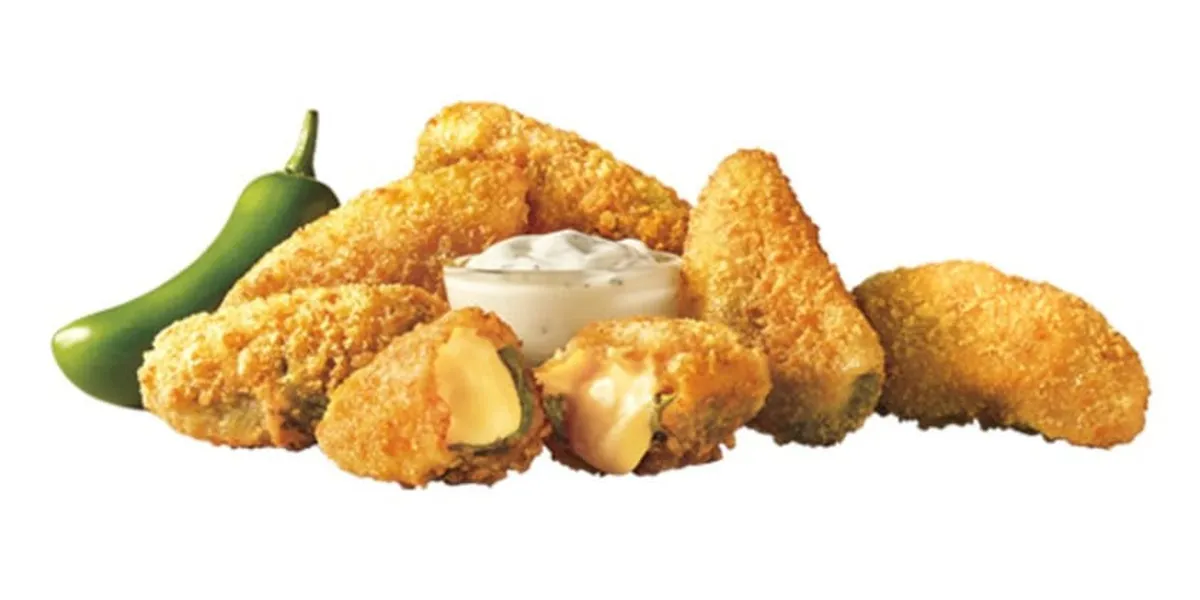 Sonic Drive-In with covered drive-up stalls, outdoor menu boards, and car-hop service area along busy Sterlington Road in...