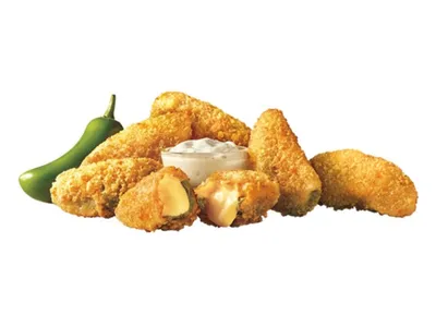 Sonic Drive-In with covered drive-up stalls, outdoor menu boards, and car-hop service area along busy Sterlington Road in...