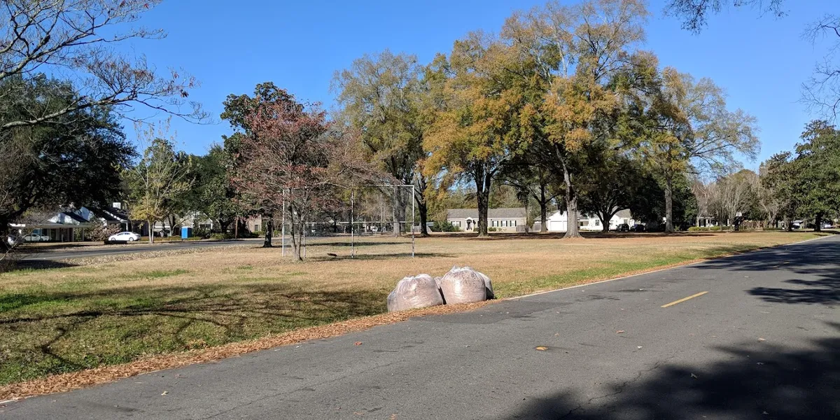 Clean, A-shaped green space at Stuart Park with well-maintained grounds, tucked quietly between residential areas along...