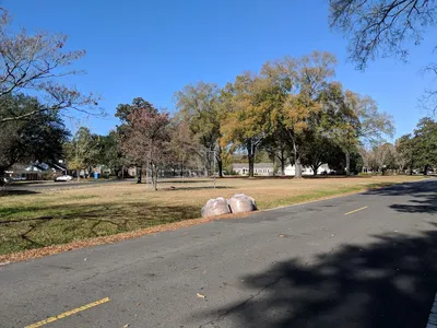 Clean, A-shaped green space at Stuart Park with well-maintained grounds, tucked quietly between residential areas along...