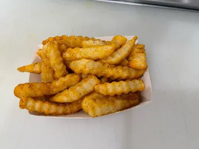 Compact, nostalgic American diner with counter service and simple seating, showcasing homestyle plate lunches in a...