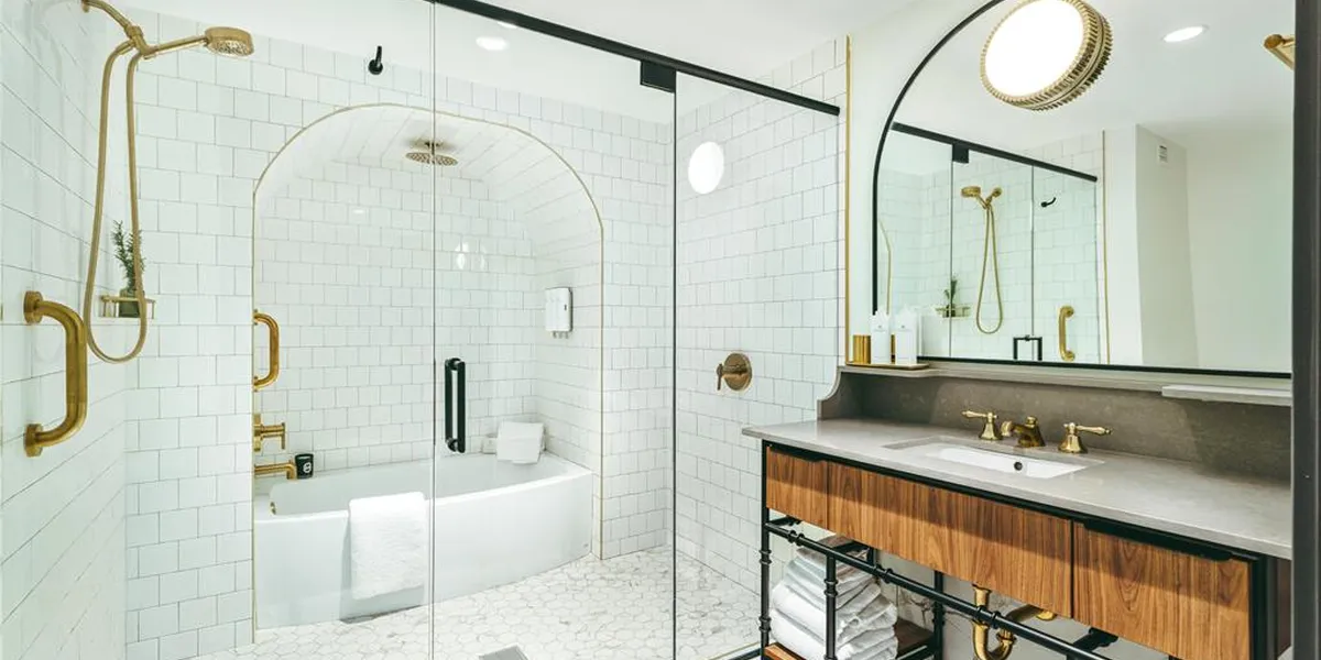 Modern boutique hotel with stylish lobby, crackling fireplace feature, and contemporary bar area in downtown Monroe's...