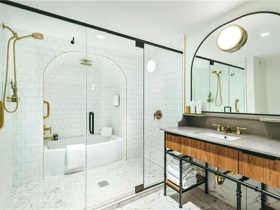 Modern boutique hotel with stylish lobby, crackling fireplace feature, and contemporary bar area in downtown Monroe's...