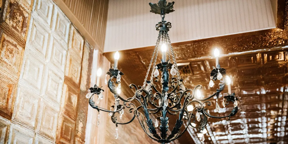 Thoughtfully arranged women's clothing boutique with carefully curated displays featuring contemporary fashion pieces and...