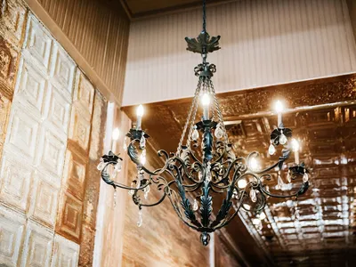 Thoughtfully arranged women's clothing boutique with carefully curated displays featuring contemporary fashion pieces and...