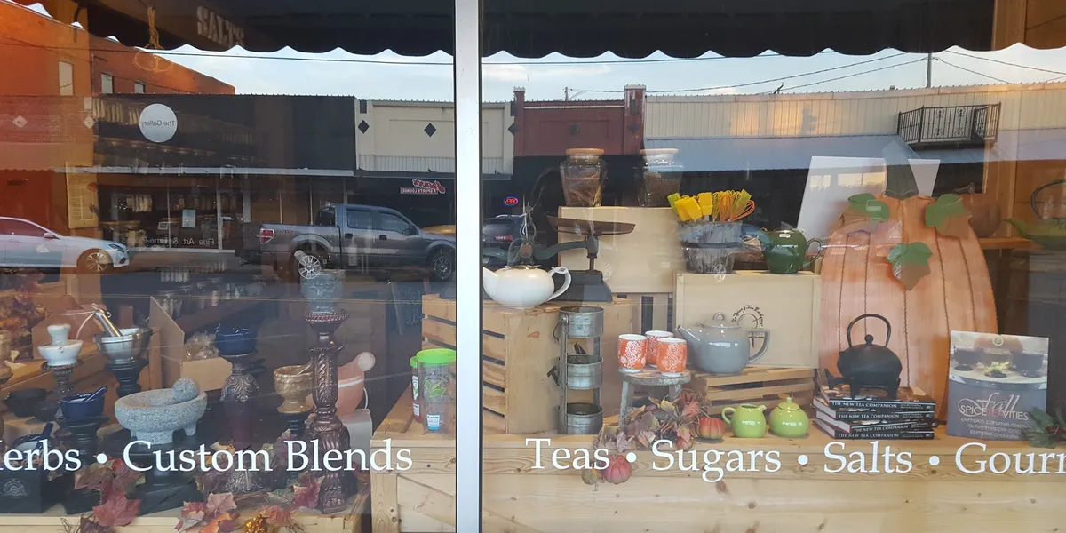 Aromatic spice and tea shop with neatly arranged shelves of colorful spices and tea varieties in a cozy Trenton Street...