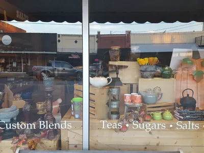 Aromatic spice and tea shop with neatly arranged shelves of colorful spices and tea varieties in a cozy Trenton Street...