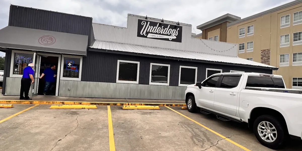 Casual grill with indoor/outdoor seating featuring Underdog burgers and sweet potato tots in a laid-back atmosphere...