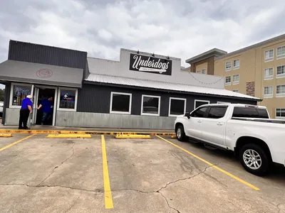 Casual grill with indoor/outdoor seating featuring Underdog burgers and sweet potato tots in a laid-back atmosphere...