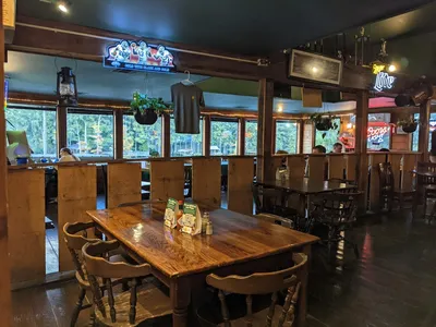 Waterfront restaurant with bayou views, outdoor patio seating, and walls adorned with local historical memorabilia...