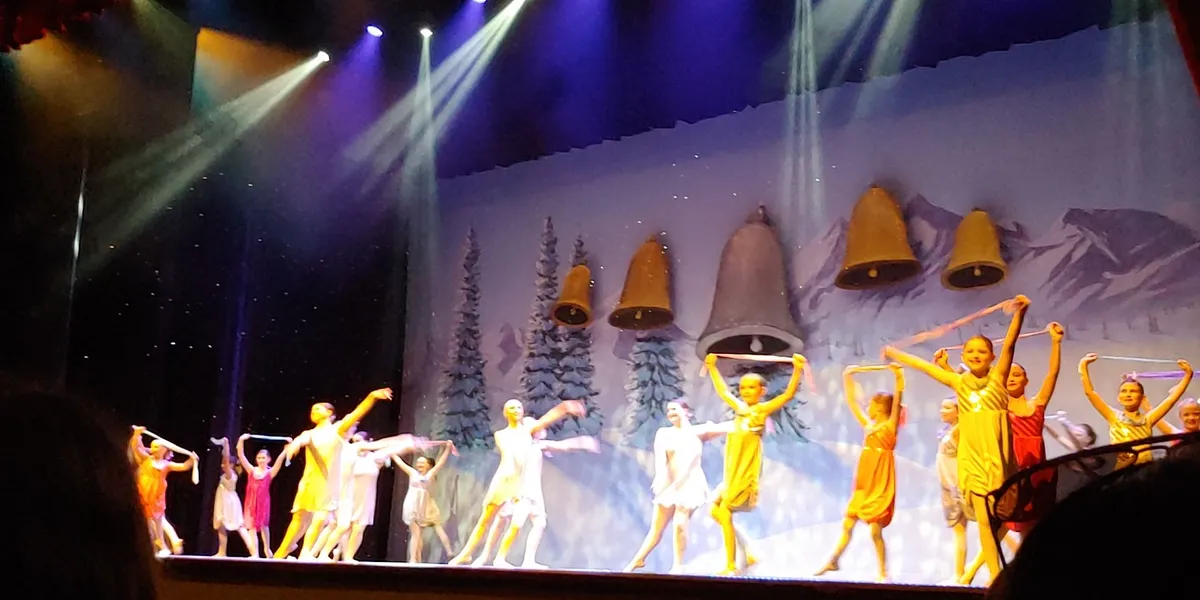 Elegant interior of WL Jack Howard Theatre with comfortable seating, well-lit stage, and clean performance space for...