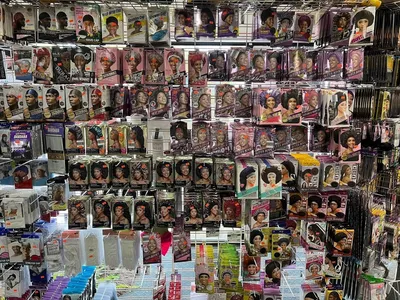 Well-stocked interior of Z Mart furniture store showing organized displays of diverse household items and uniforms in a...