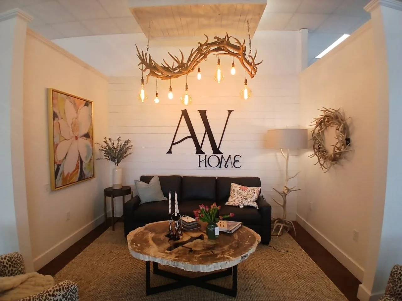 Guests mingling and tasting wine at the Apero event in a stylishly decorated room.