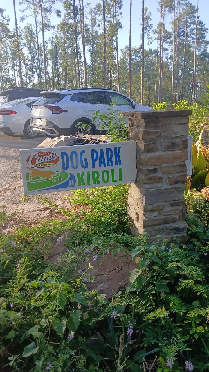The entrance sign for the Raising Cane's Dog Park at Kiroli Park.