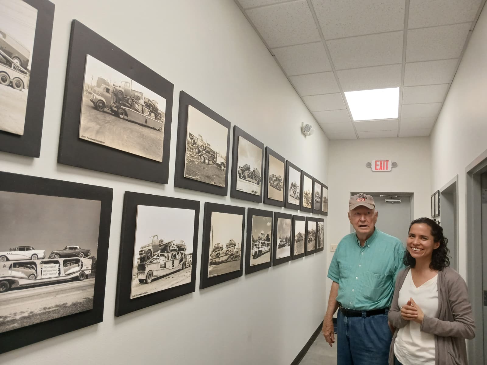 Charles Rand, antique car collector, with a visitor in the hallway of his Vintage Vehicles showroom in West Monroe Louisiana